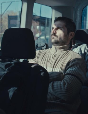 A man seated on a bus