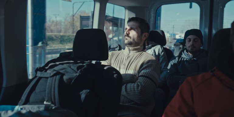 A man seated on a bus